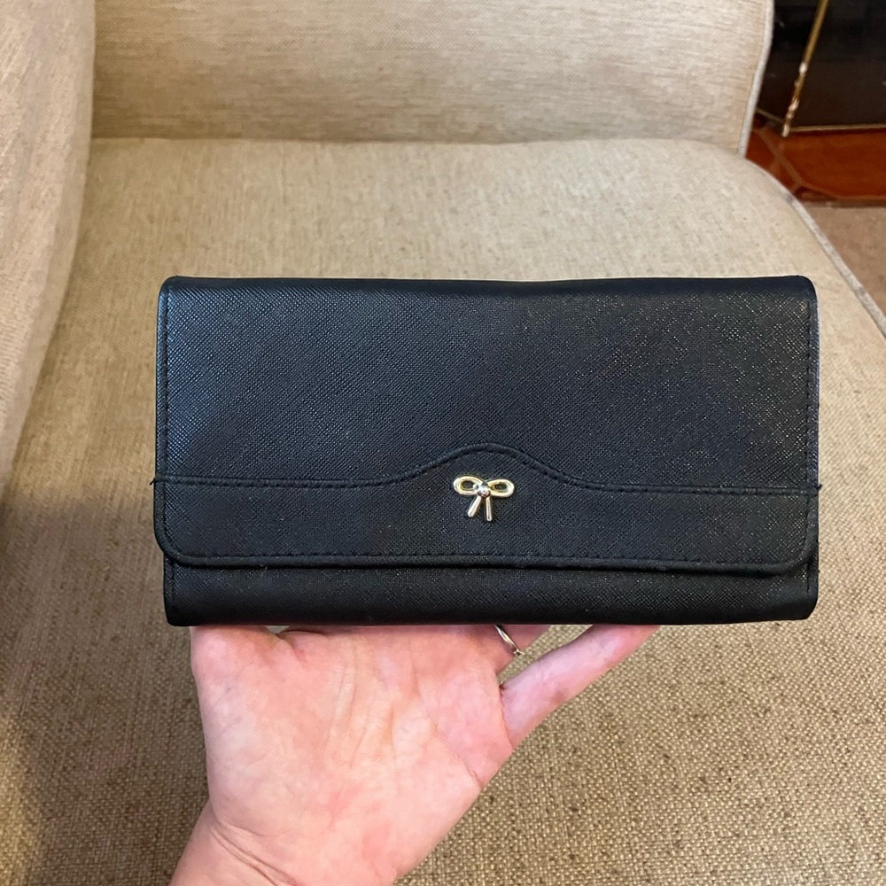 Black leather wallet with bow design
